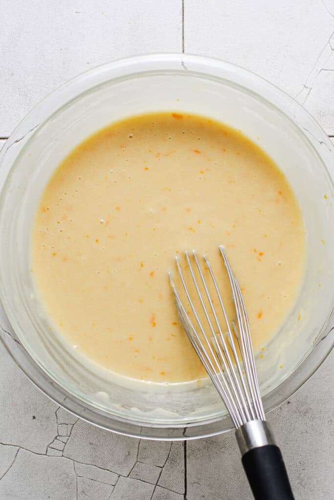 Smooth mantecada batter whisked together in a bowl.