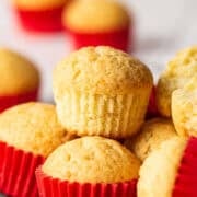 Golden-yellow mantecada muffins baked to perfection with a signature red liner.