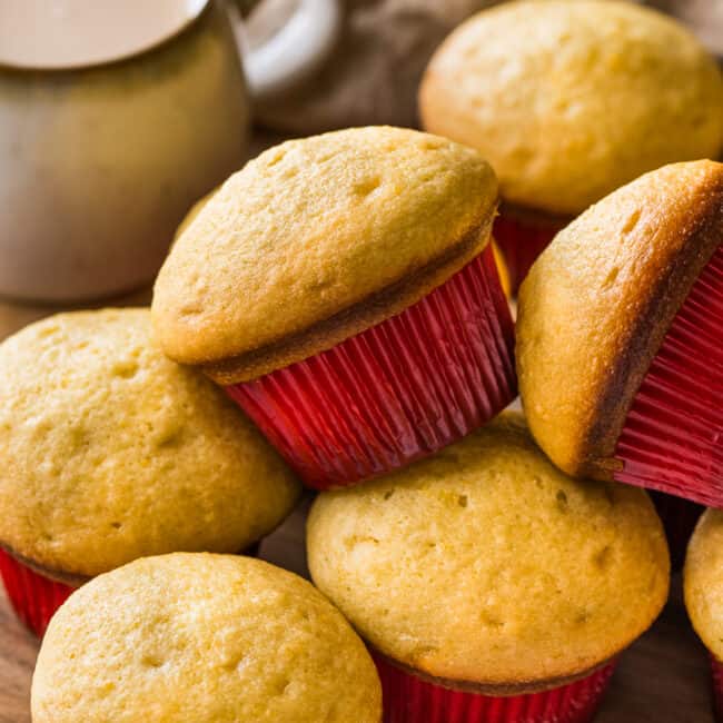 Mantecadas on a table with a red muffin cupcake liner.