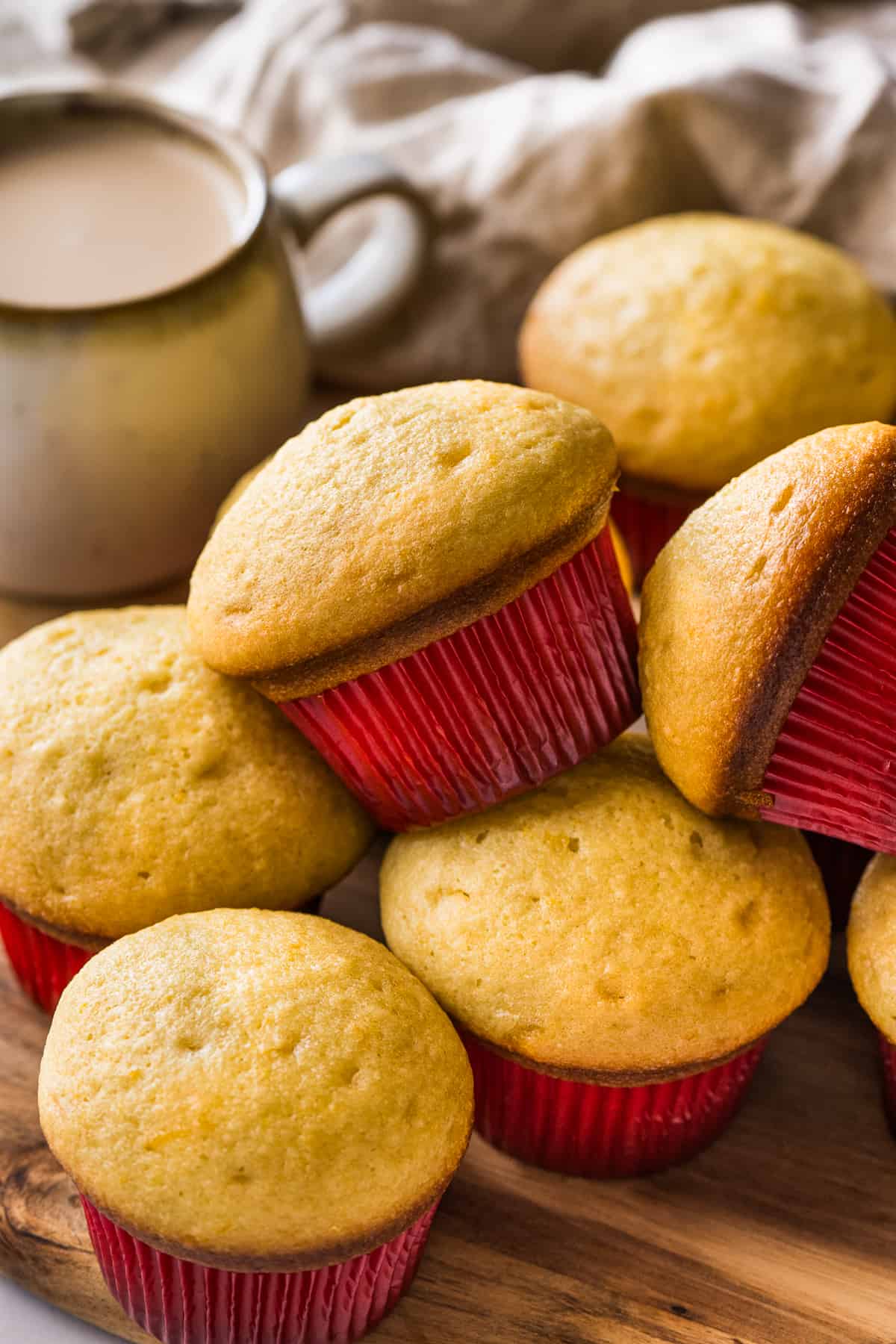 Mantecadas on a table with a red muffin cupcake liner.