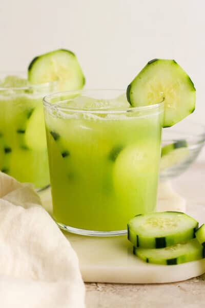 Agua de pepino (Mexican cucumber agua fresca) in glasses garnished with cucumber slices.