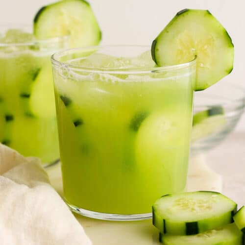 Agua de pepino (Mexican cucumber agua fresca) in glasses garnished with cucumber slices.