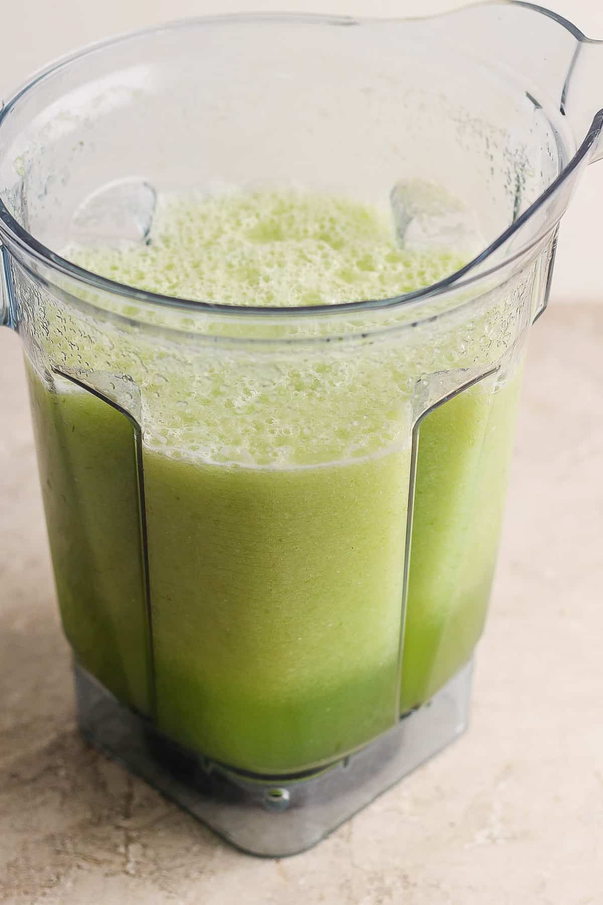 Blended agua de pepino in a blender before being strained.
