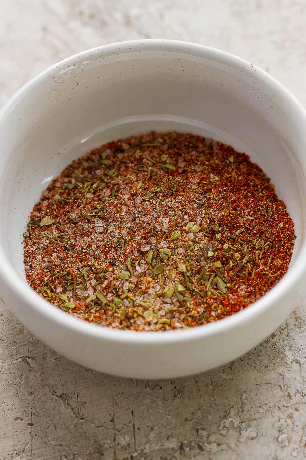 A mix of seasonings in a small bowl for air fryer whole chicken.