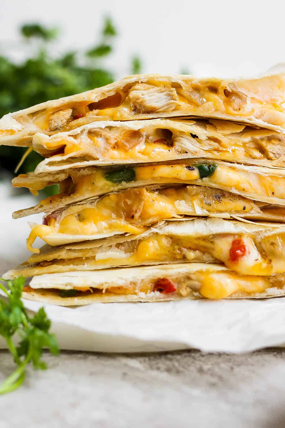 Chicken quesadillas stacked on top of one another.