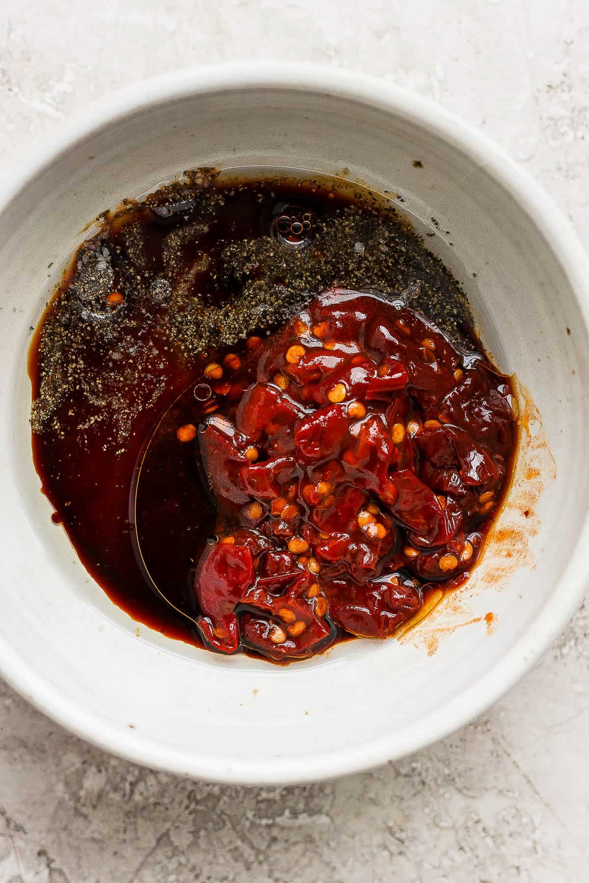 Honey, chipotle peppers, and soy sauce in a small bowl.