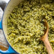 Arroz verde (Mexican green rice) in a large pot with a serving spoon.