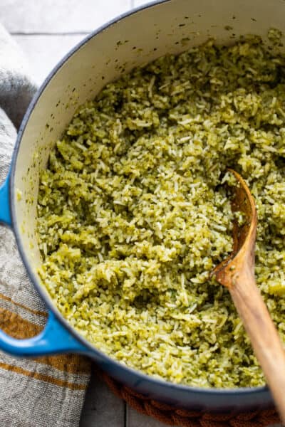 Arroz verde (Mexican green rice) in a large pot with a serving spoon.