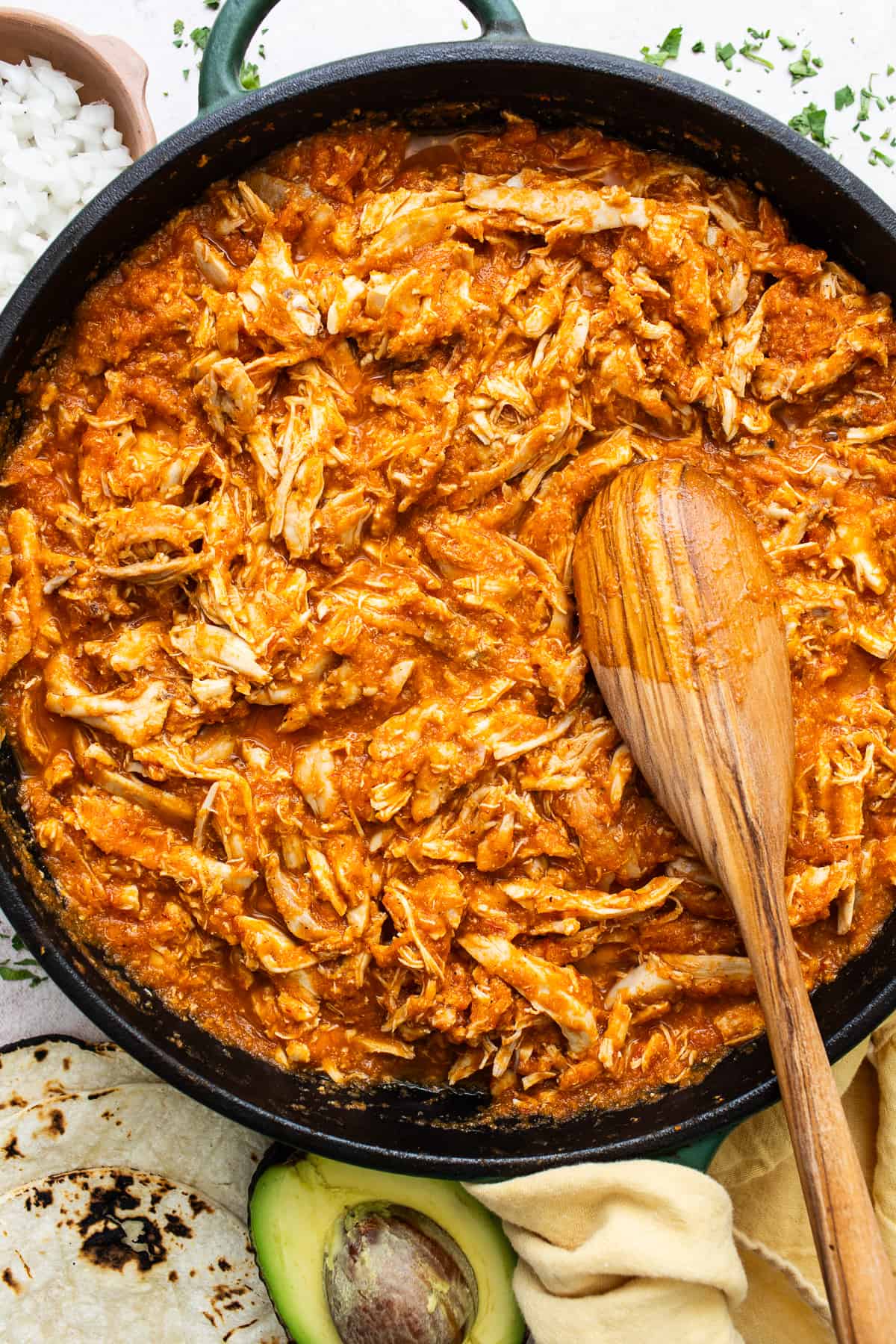 Chicken Tinga is a classic Mexican dish that combines tender chicken with a smoky tomato sauce made with chipotles in abodo. It's great for serving in tacos, tostadas, burritos, sopes, enchiladas, and more!