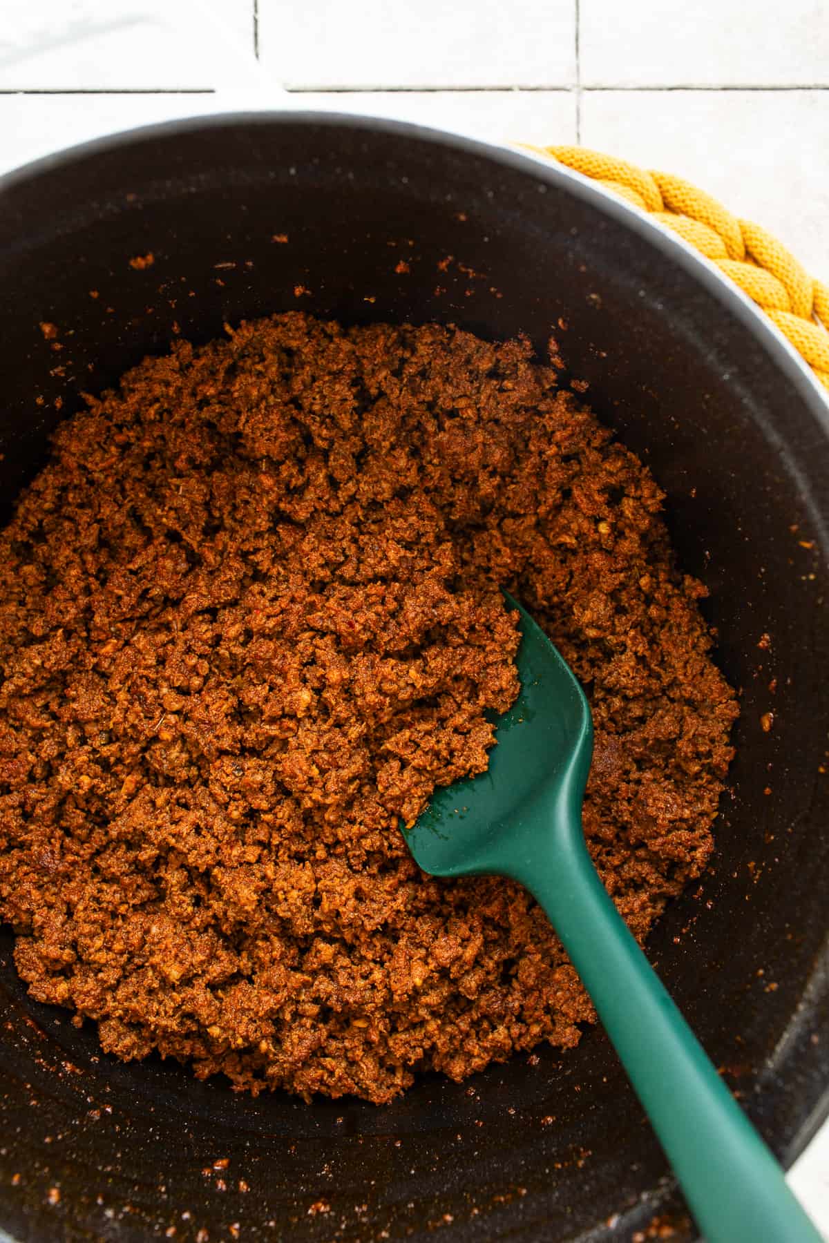 Cooked ground beef and chorizo in a pot.