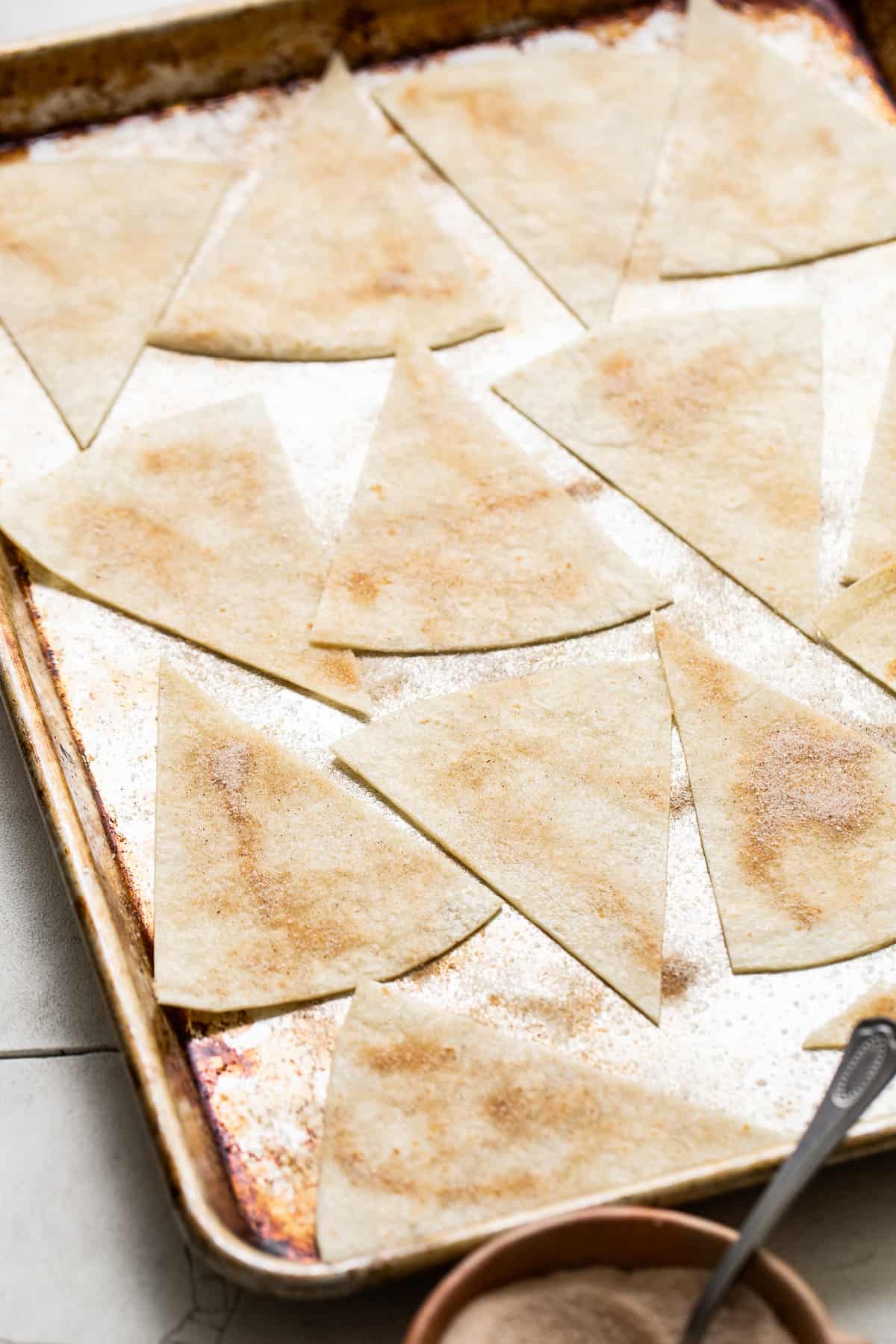 Flour tortillas sliced into triangles and sprinkled with cinnamon sugar.