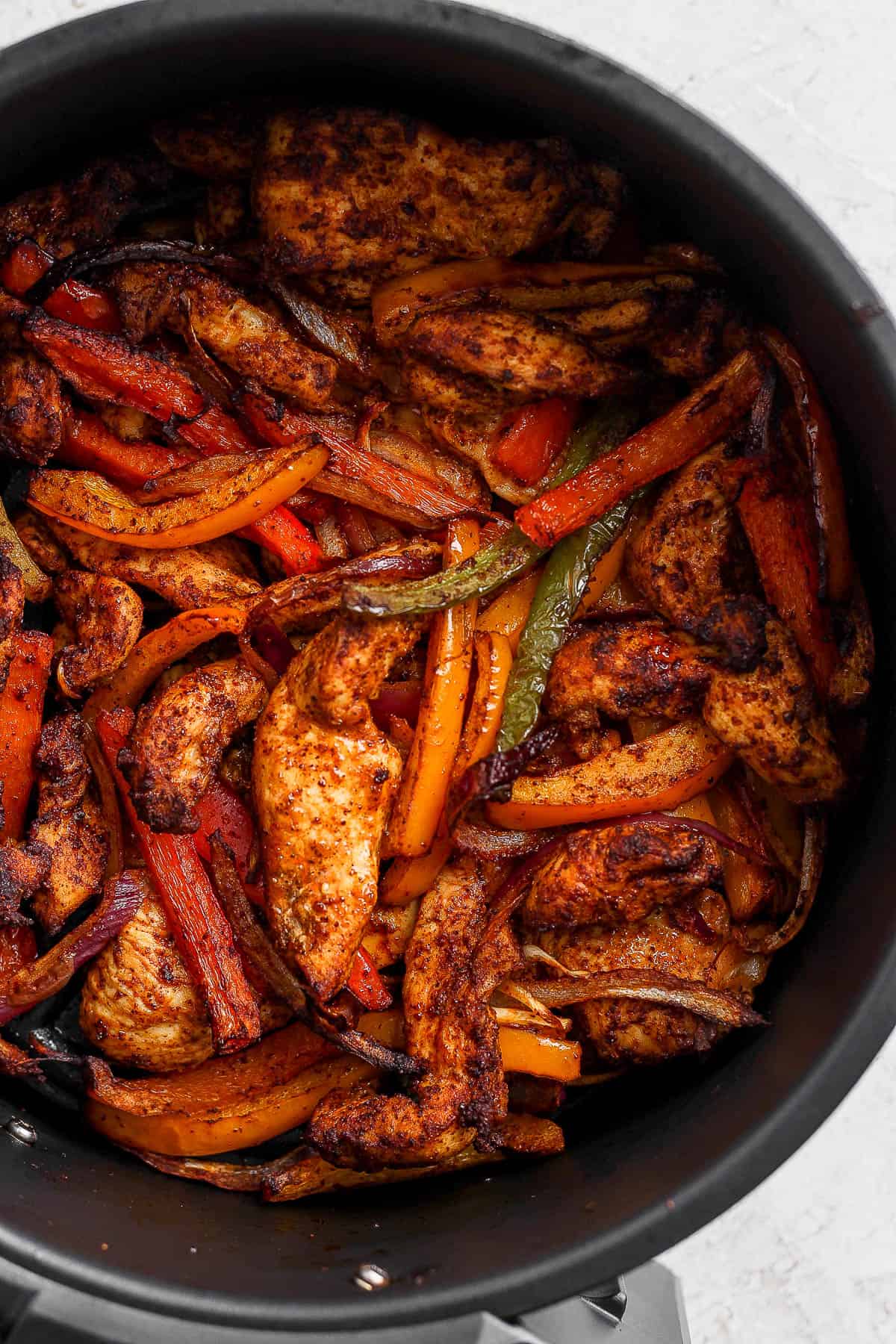 Cooked chicken fajitas in the air fryer bowl