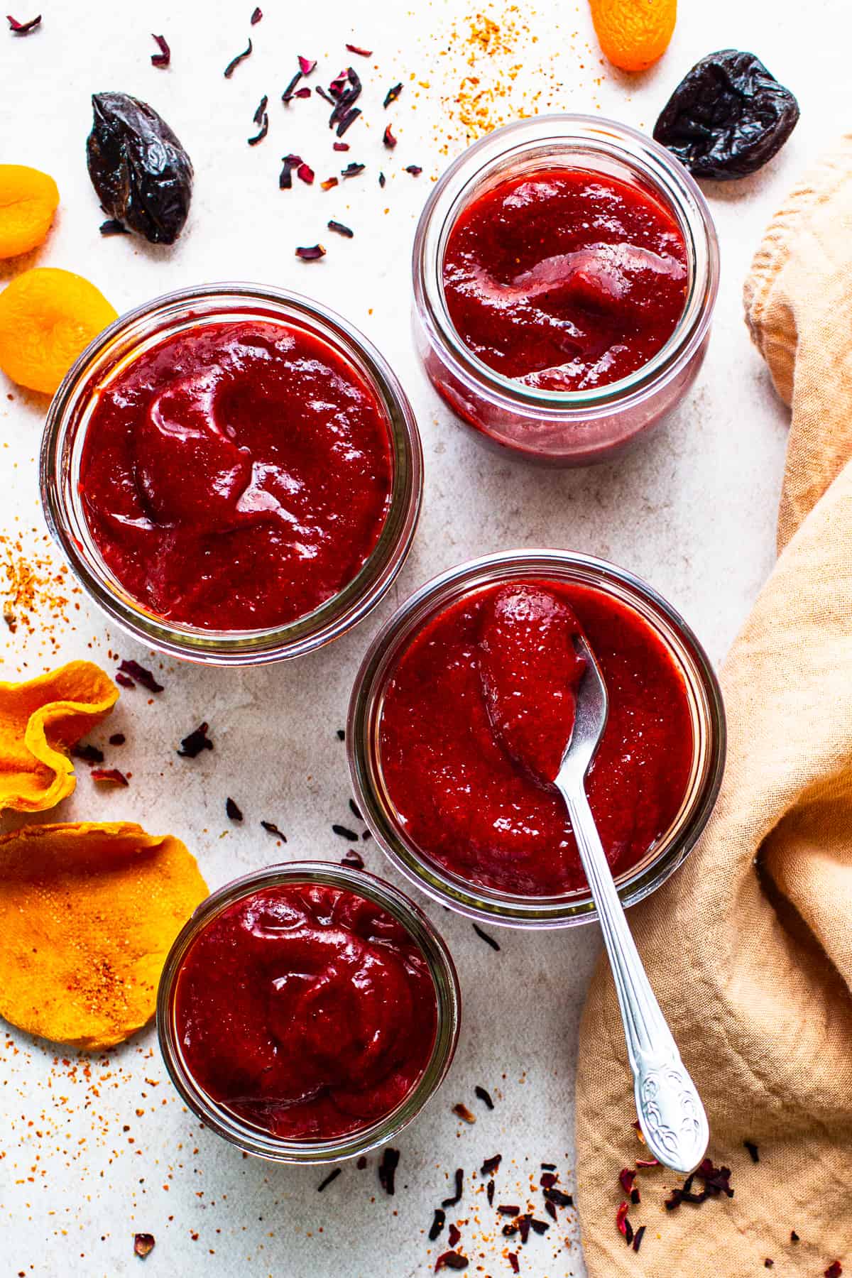 Jars filled with homemade chamoy sauce ready to be eaten.