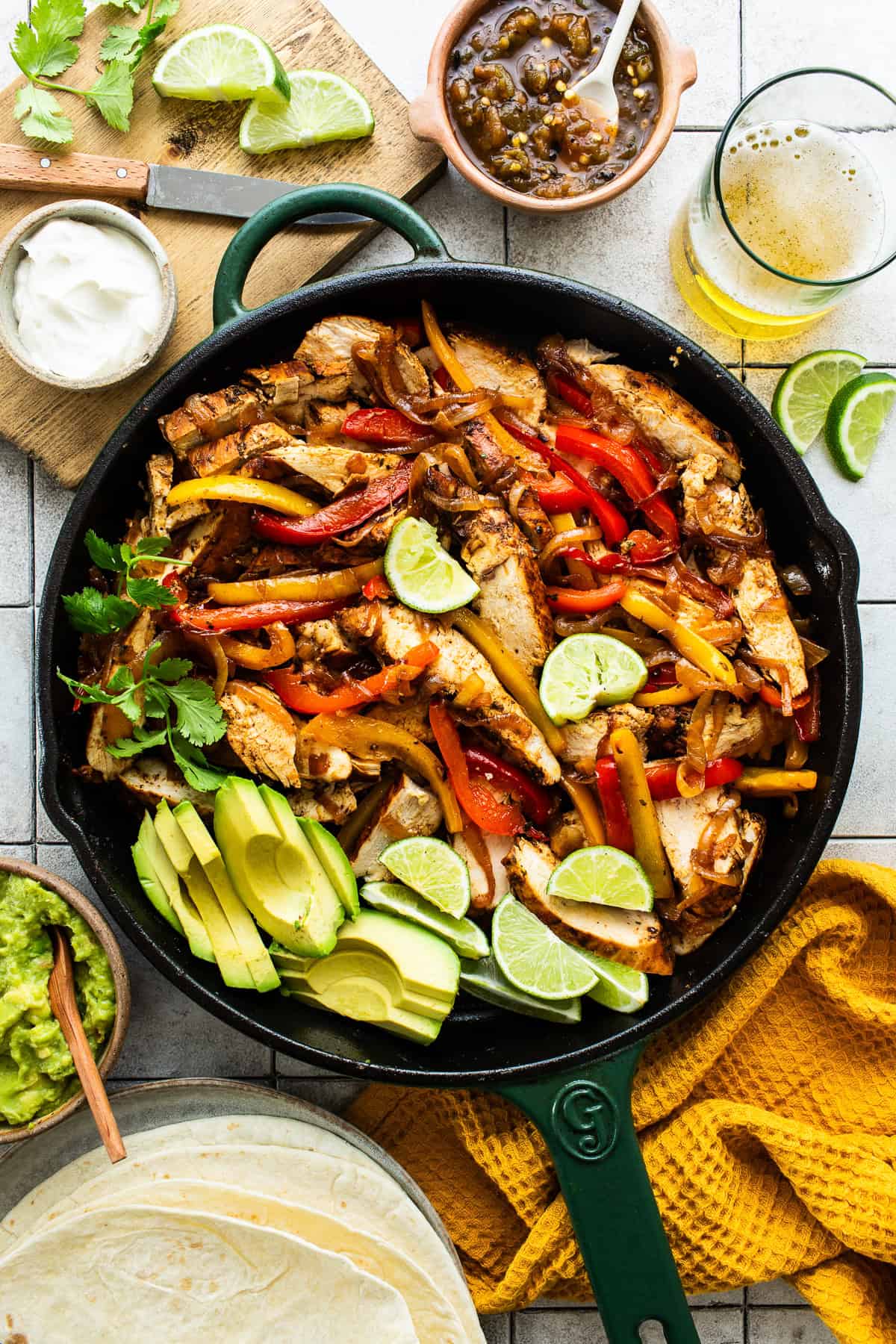 Pan-fried chicken fajitas topped with lime, cilantro and avocado.