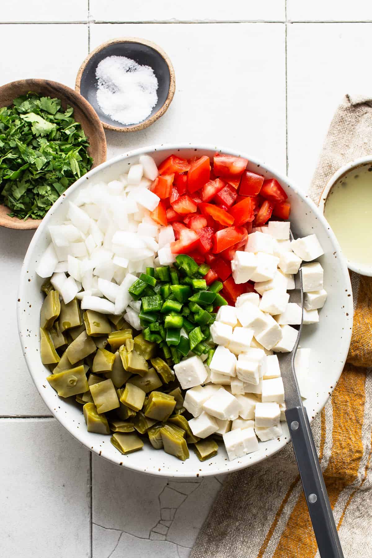 Various vegetables diced up in a bowl