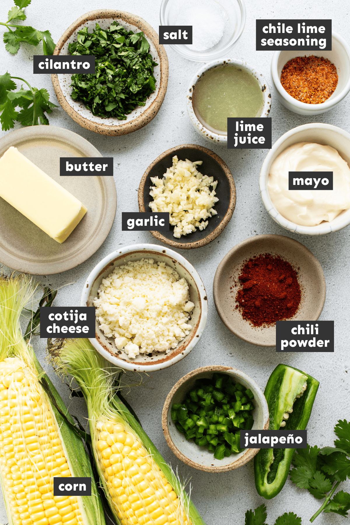 Esquites ingredients all measured out into small bowls