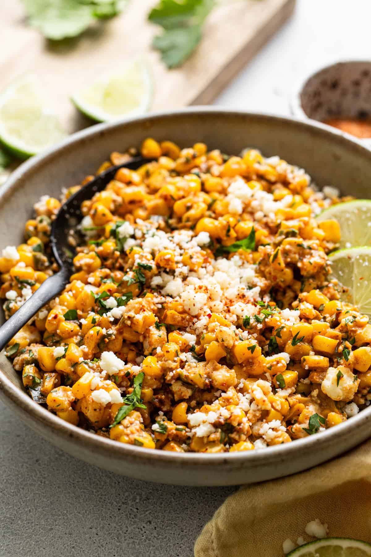 Esquites or Mexican street corn salad plated in a deep bowl