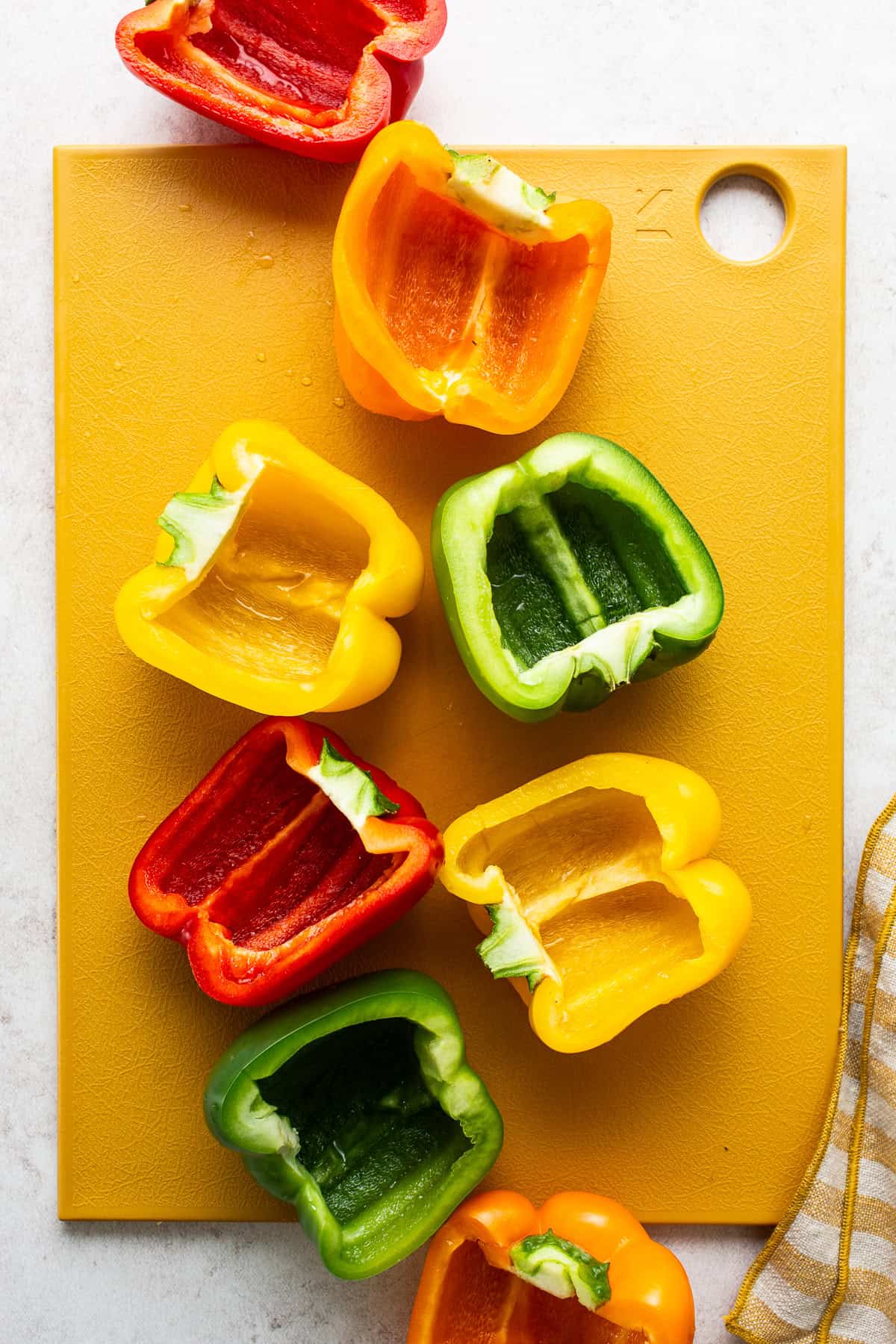 Bell peppers cut in half, seeds and veins removed.