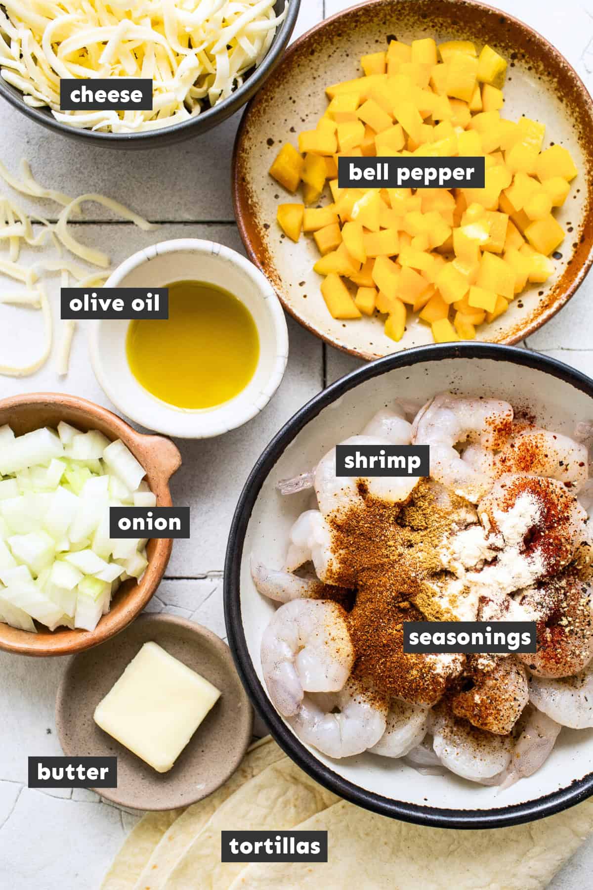 Ingredients in shrimp quesadillas on a table.