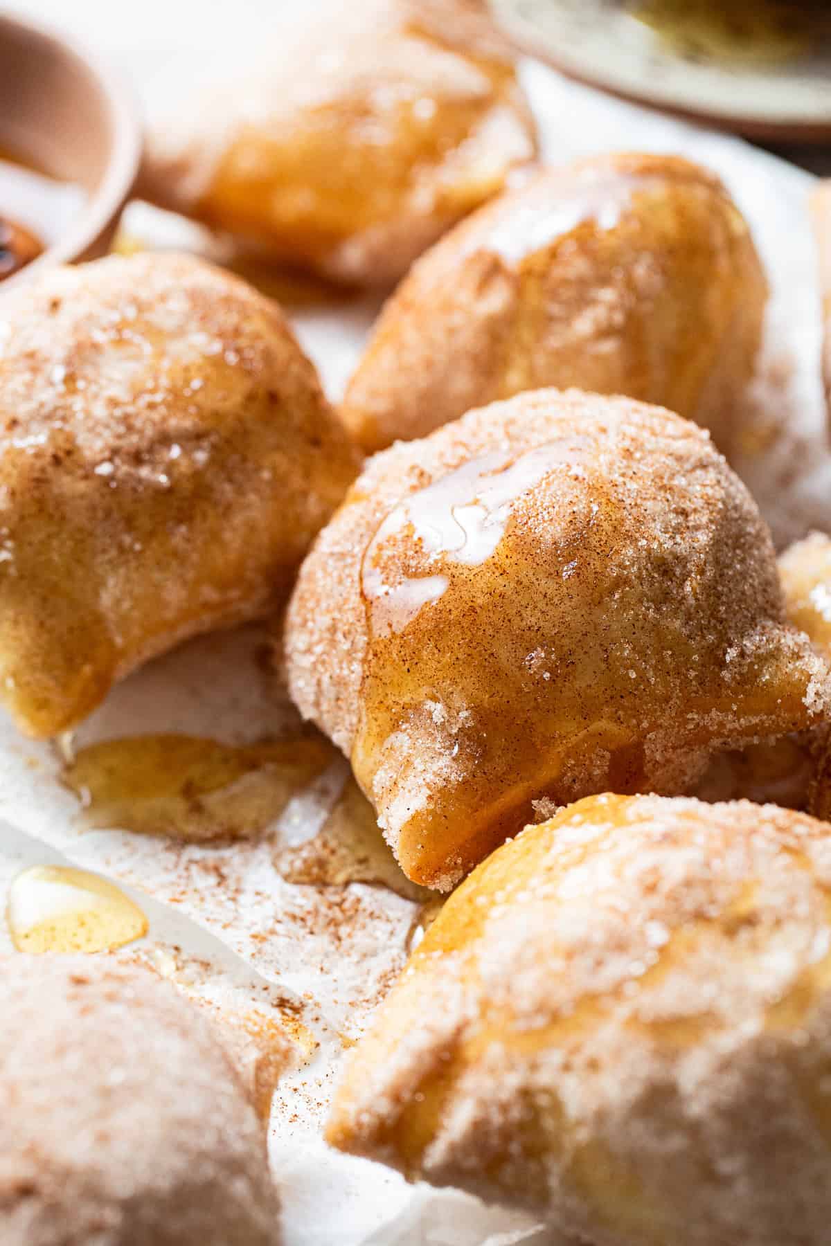 Sopapillas covered in honey and ready to eat.