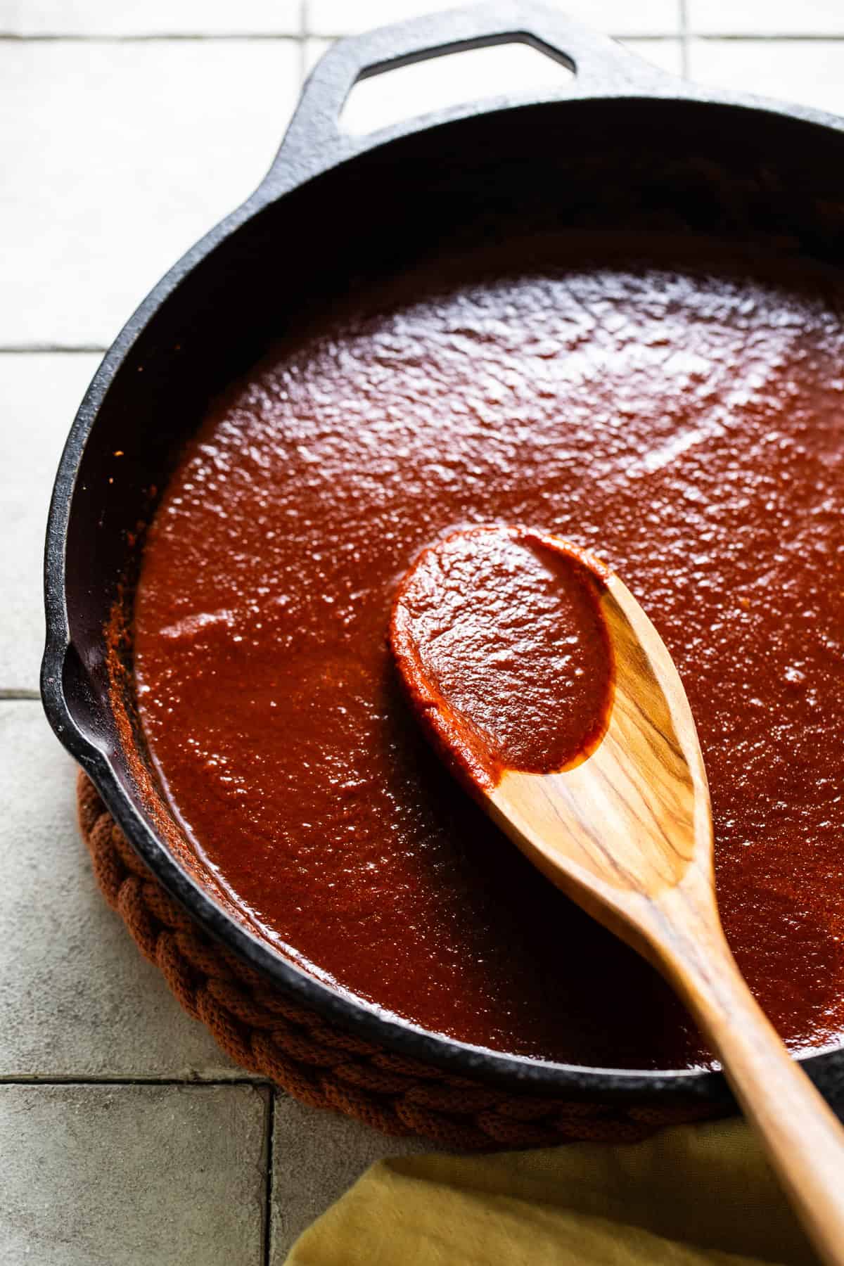 Sauce is simmering in a large skillet