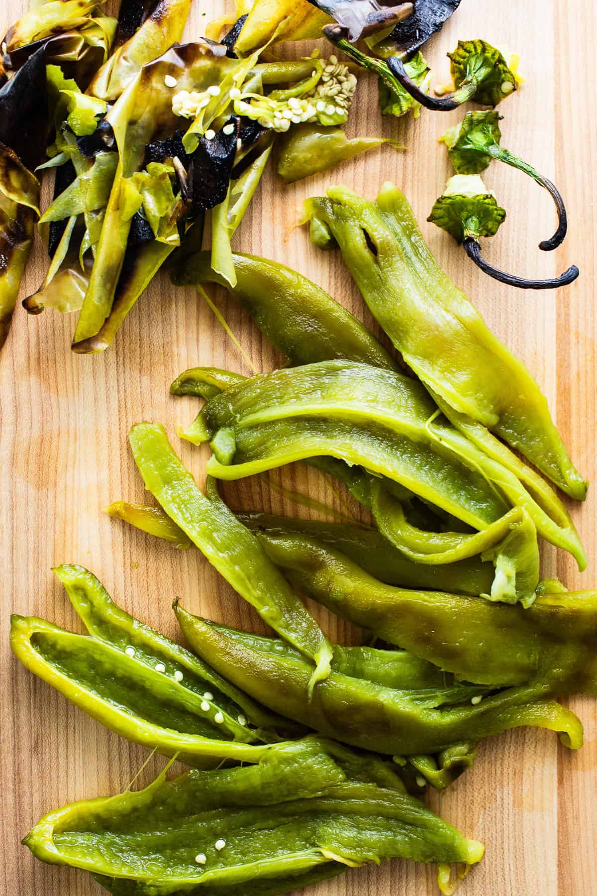 Peppers with peeled skin on a cutting board