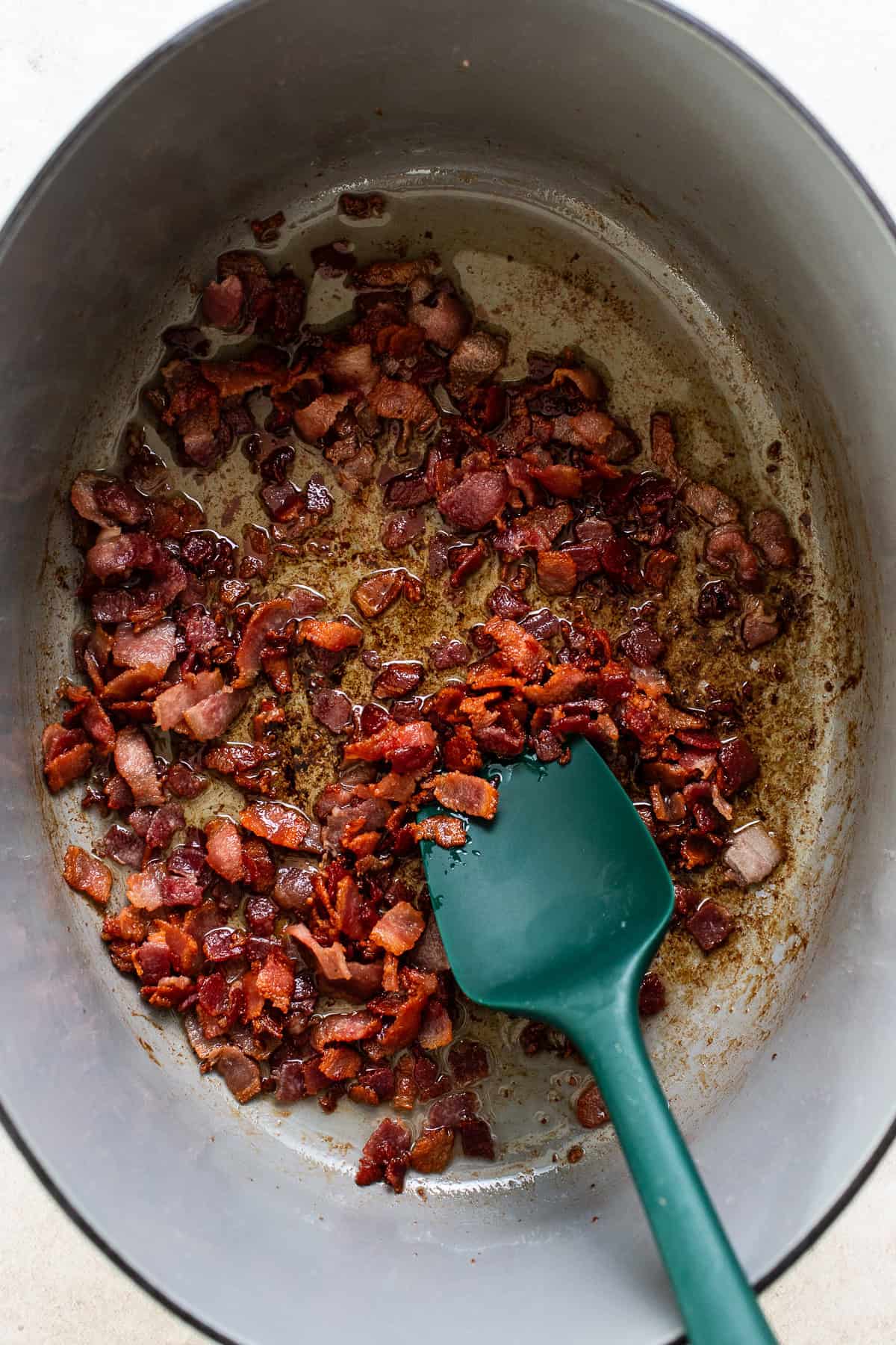 Bacon in a large dutch oven cooked until crispy
