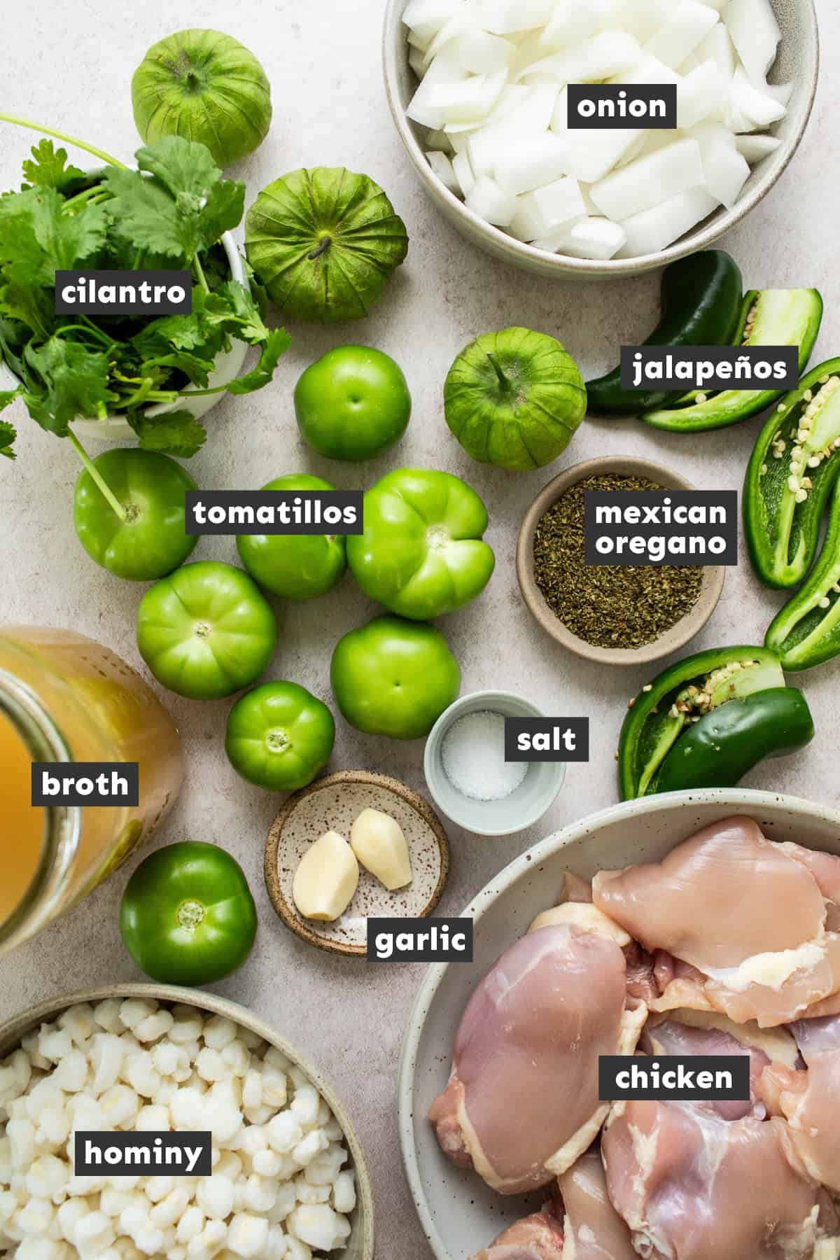 All pozole verde ingredients laid out on a table ready to use.