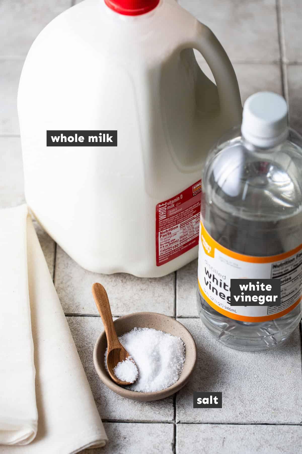 The ingredients used for a queso fresco recipe laid out on a table ready to use.