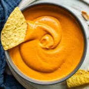 Salsa de cacahuate in a bowl with a tortilla chip.