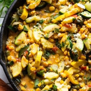 The best calabacitas recipe in a skillet with a light cheese sauce.
