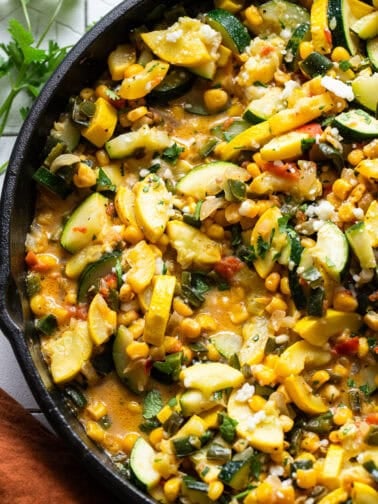 The best calabacitas recipe in a skillet with a light cheese sauce.