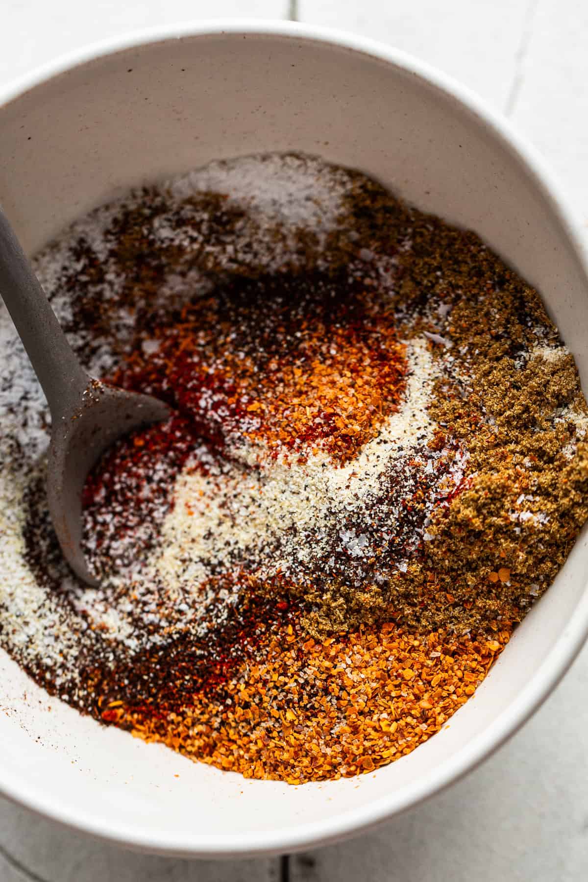 Fajita seasoning ingredients in a bowl before being mixed together.