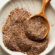 Fajita seasoning recipe blend in a bowl with a measuring spoon.