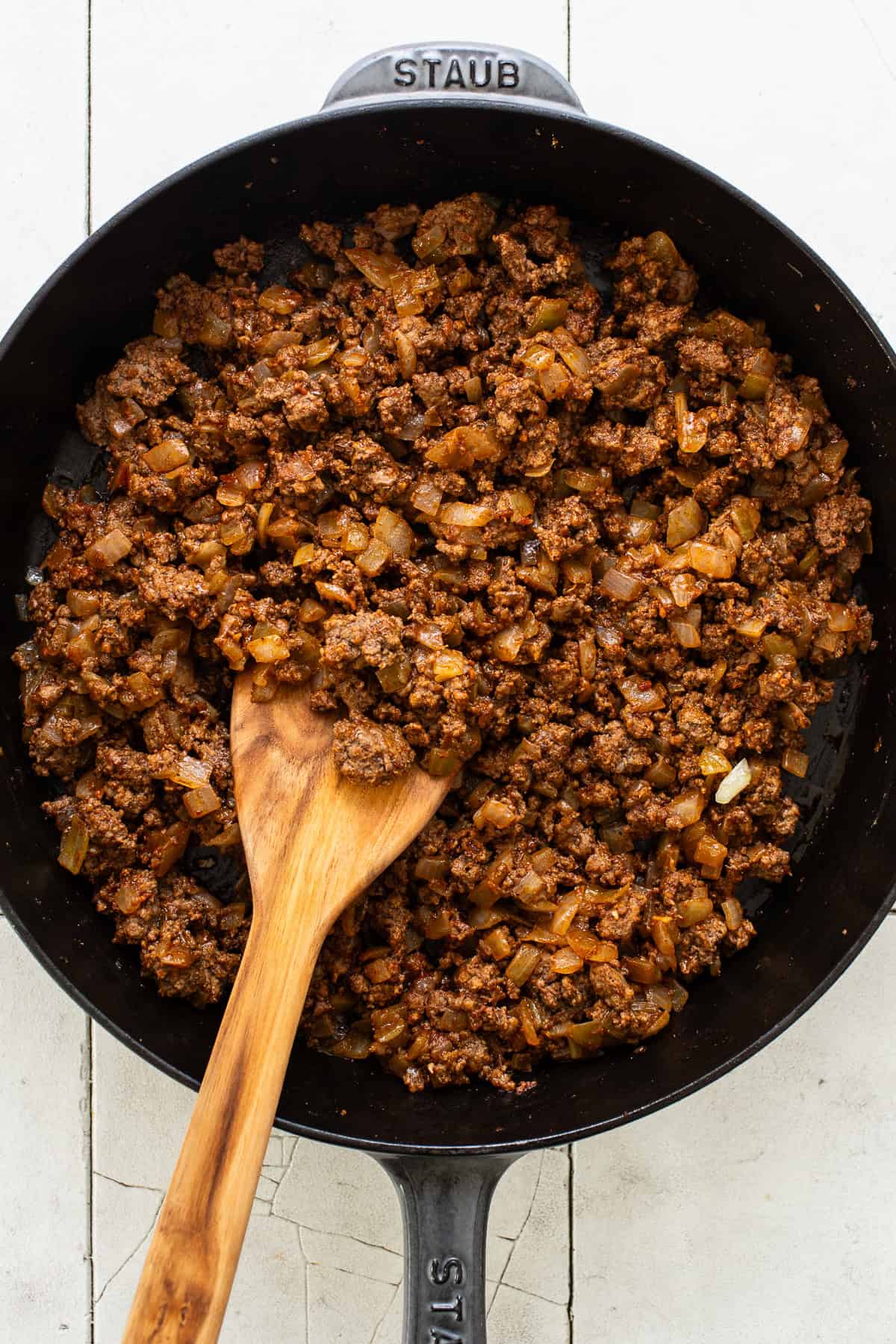 Seasoned ground beef filling for crunchwrap supremes in a skillet.
