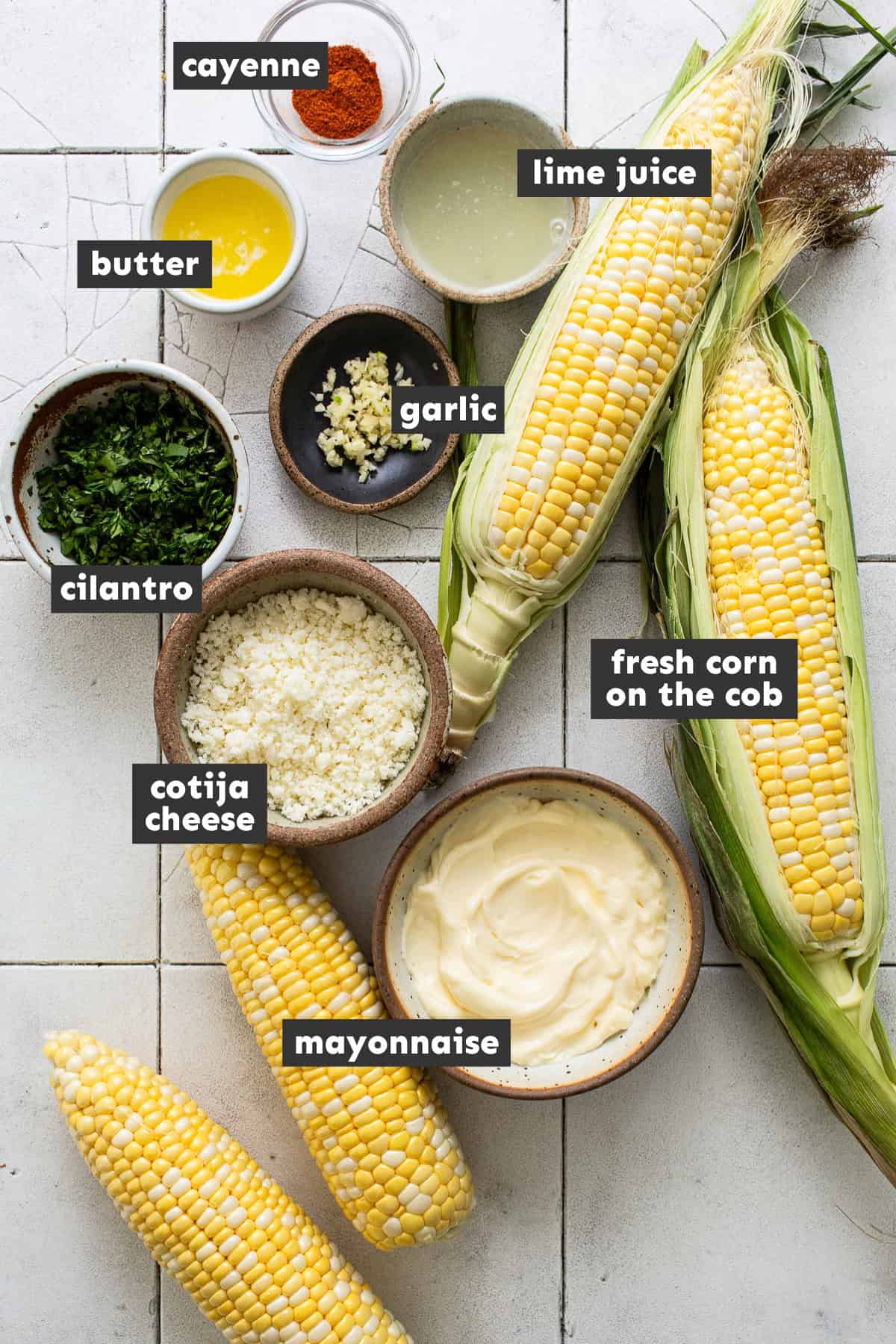 Elote recipe ingredients on a table.