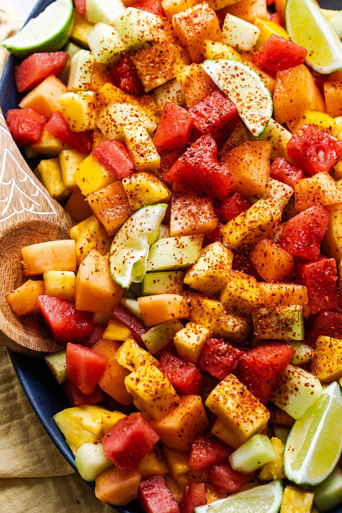 Diced fruit sprinkled with Tajin chili lime seasoning and lime juice.