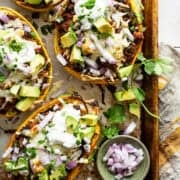 Stuffed spaghetti squash with ground chicken and black beans ready to serve.