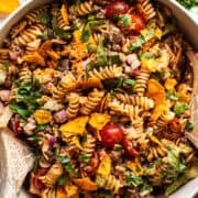 A taco pasta salad in a bowl ready to be served.