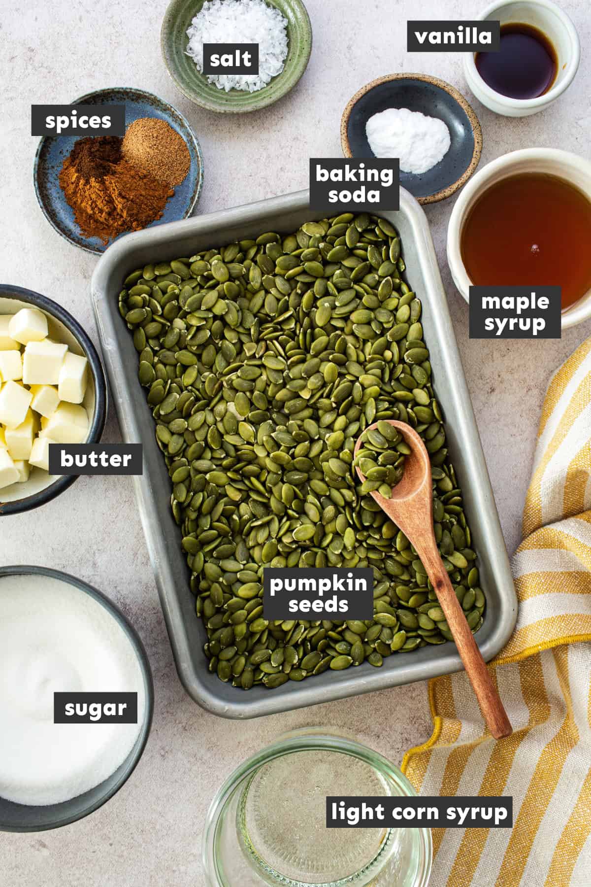 Ingredients in pumpkin seed brittle on a table.
