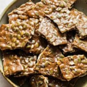 Pieces of pumpkin seed brittle in a bowl ready to serve.
