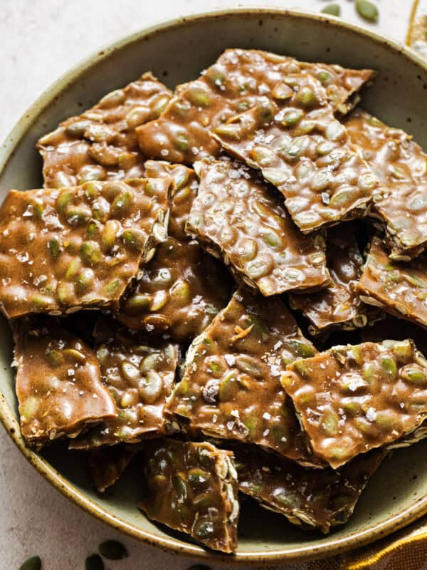 Pieces of pumpkin seed brittle in a bowl ready to serve.