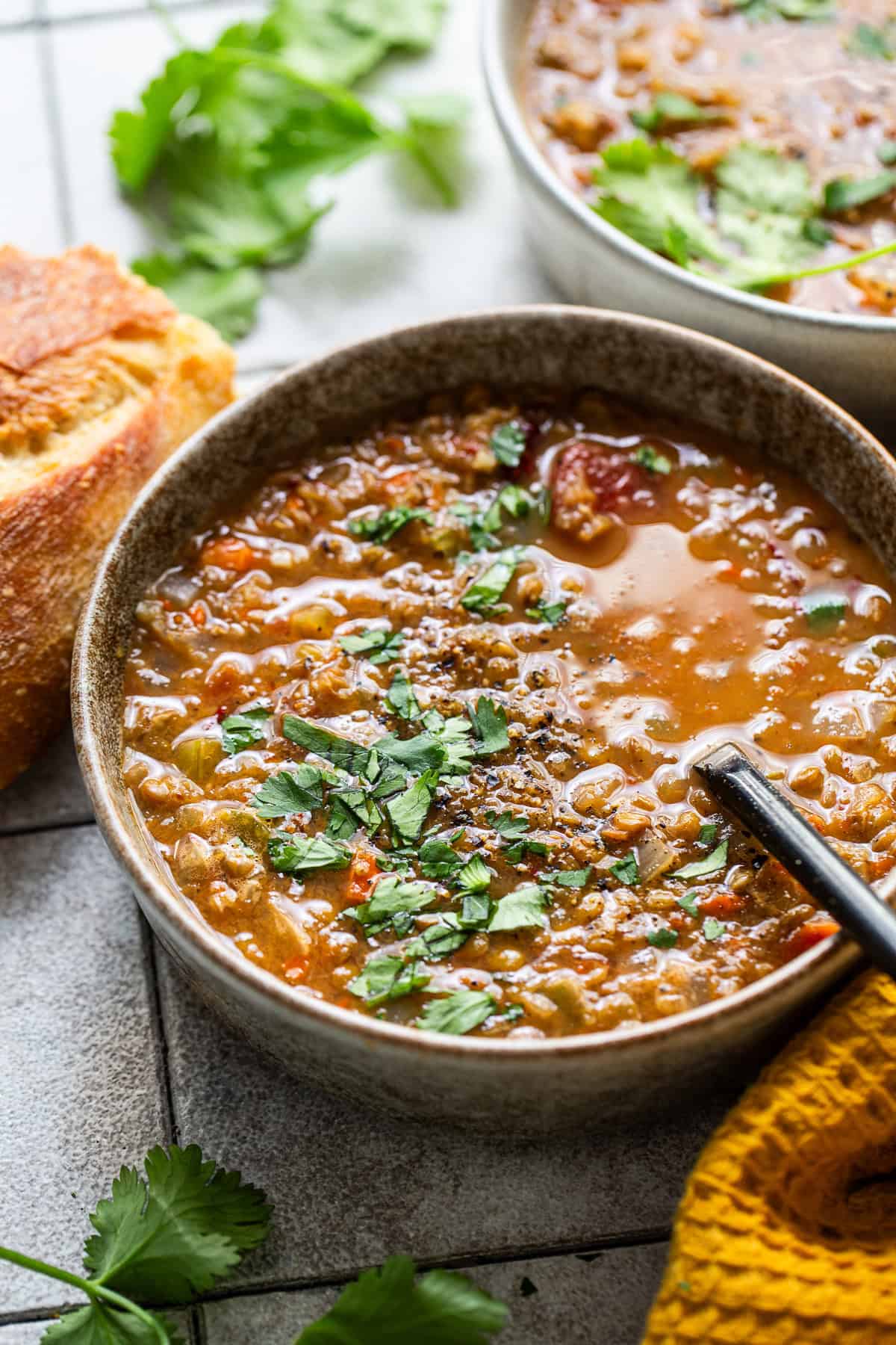 Finished slow cooker lentil soup in a bowl.