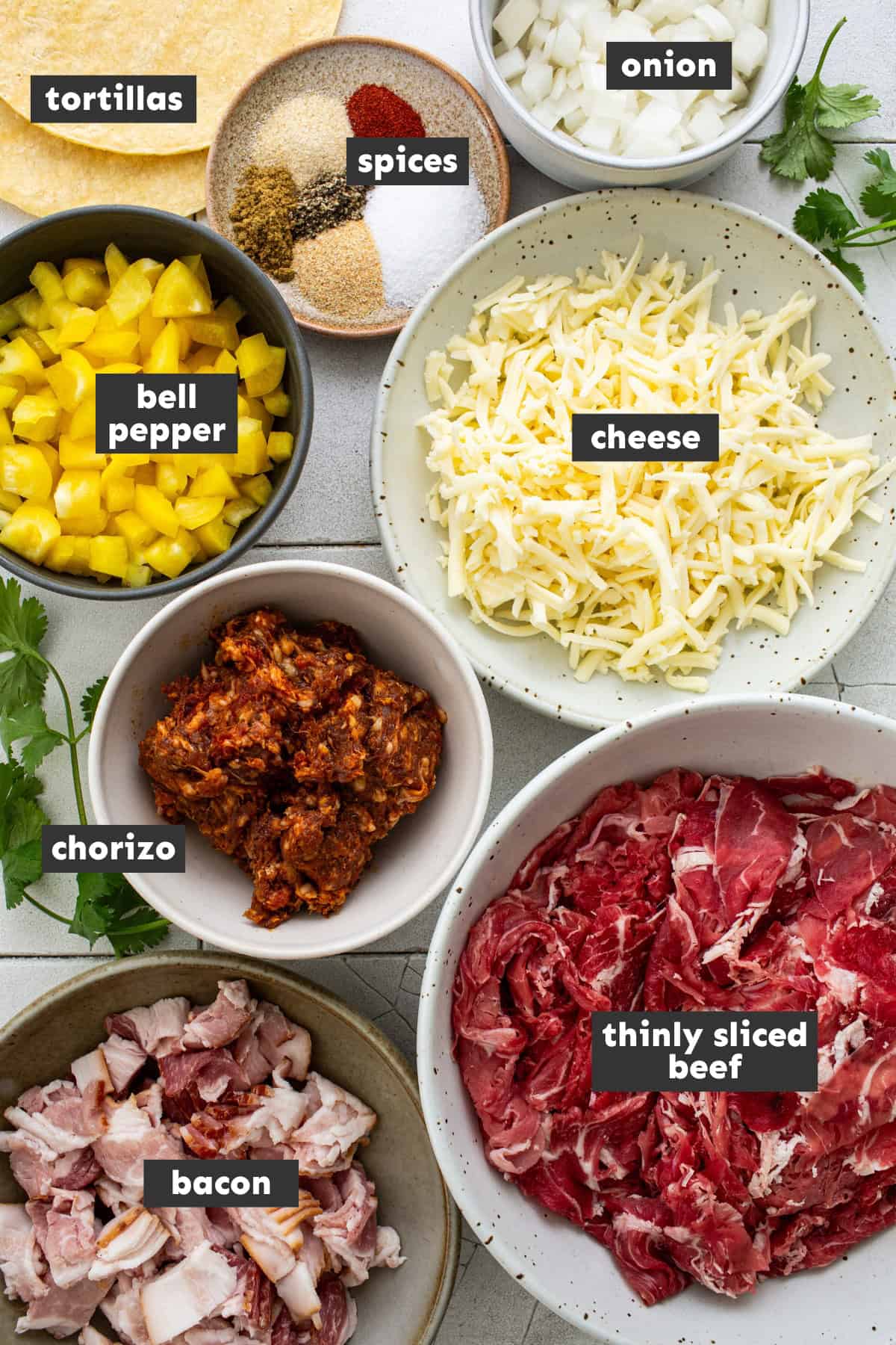 Ingredients in tacos de alambre on a table.