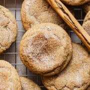 Churro cookies on a wire rack with cinnamon sugar