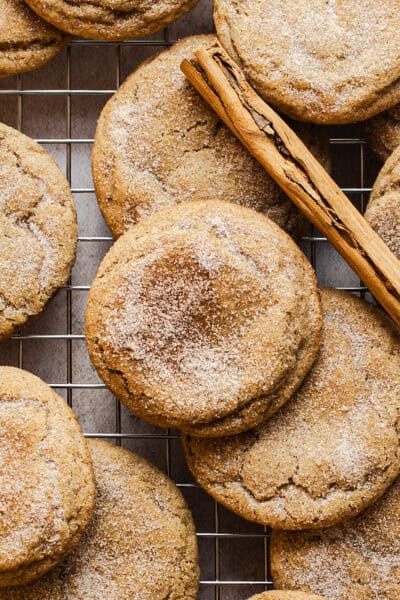 Churro cookies on a wire rack with cinnamon sugar