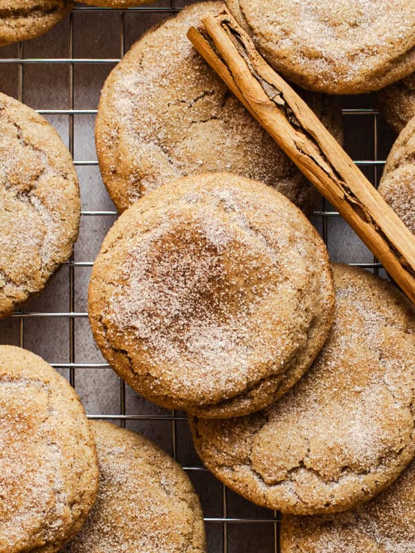 Churro cookies on a wire rack with cinnamon sugar