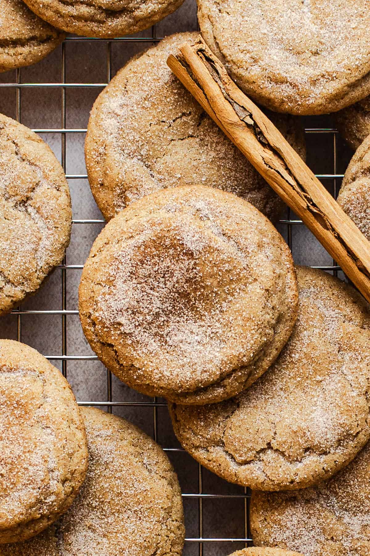 Churro cookies on a wire rack with cinnamon sugar