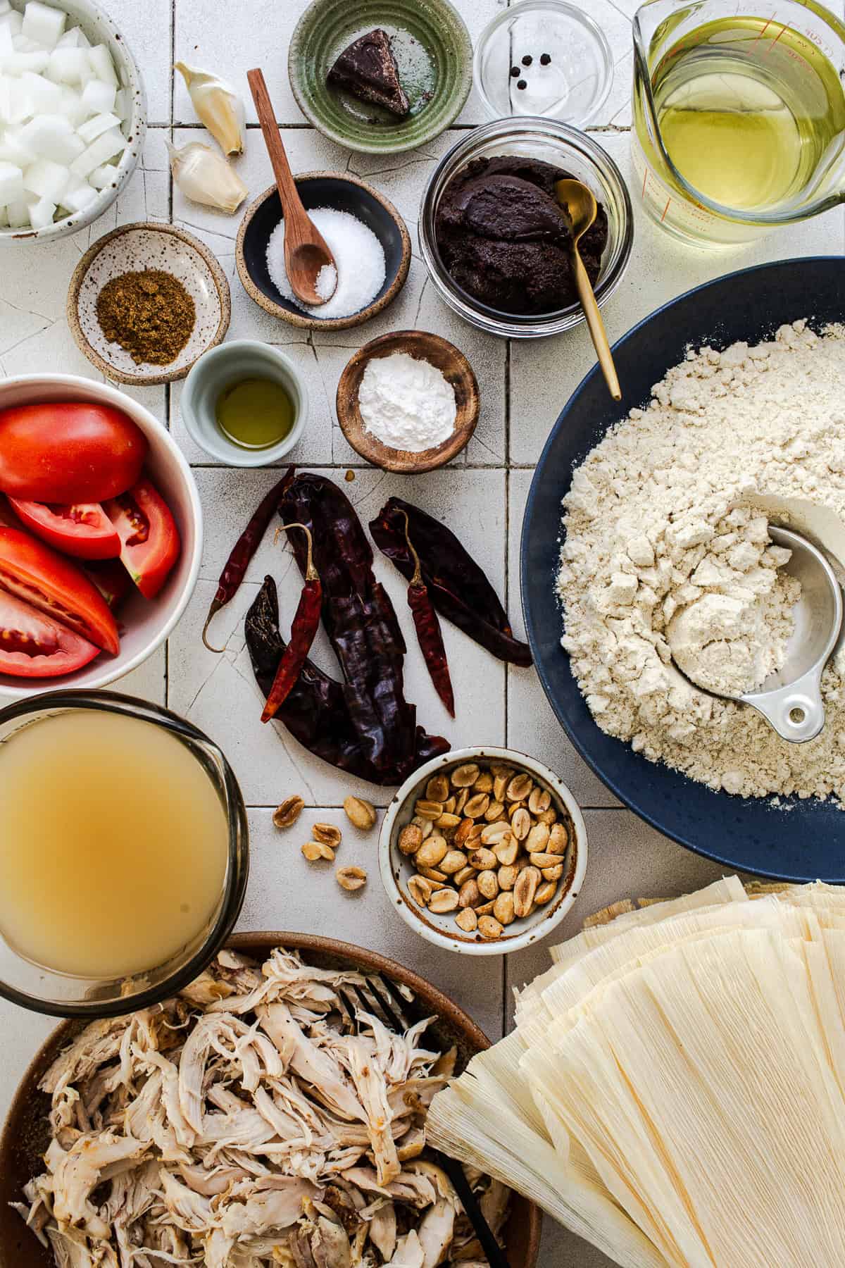 Ingredients for tamales de mole on a table.