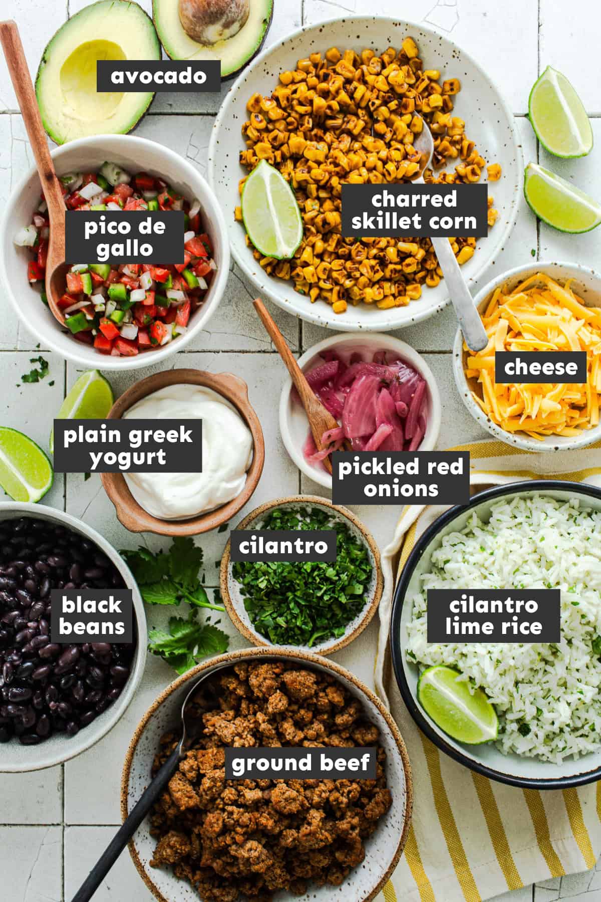 Ingredients in healthy taco bowls on a table.
